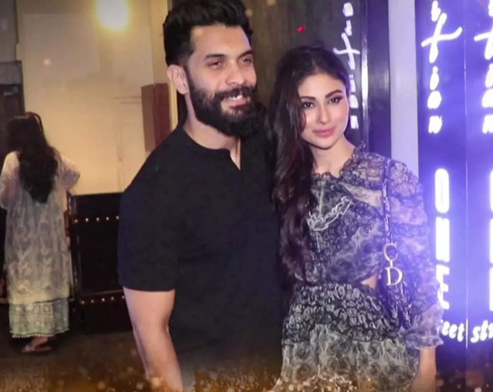 
Spotted! Mouni Roy wears a short dress, hubby Suraj Nambiar dons a black coloured T-shirt paired with white pants
