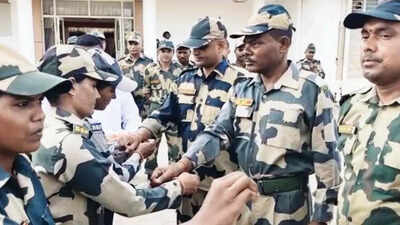 BSF women jawans tie rakhis to fellow men BSF jawans celebrate Raksha Bandhan at all the border outposts banner img