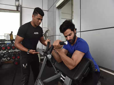 Ready to hit the gym? Here's why you must get a good fitness coach - Times  of India