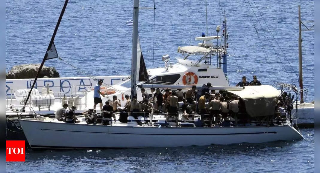 Two sailboats carrying dozens of migrants reach Greek island – Times of India