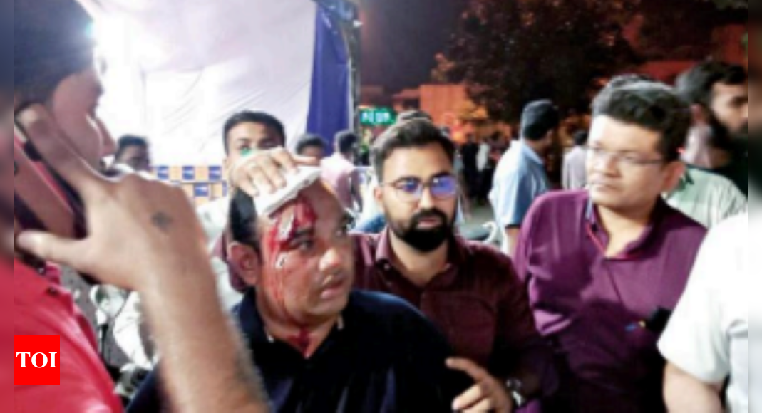 Surat: Sorathiya injured in AAP, BJP clash over banner | Surat News – Times of India