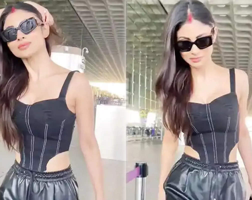 
Mouni Roy flaunts her sindoor in a deep-neck black outfit at the airport, fans say 'She is fire'

