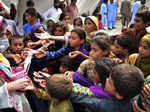 Jaffarabad: Children line up for relief after heavy rain in Jaffarabad, a distri...