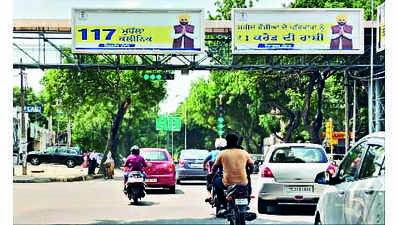 Rules bent, CM posters above traffic signals