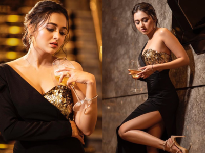 Tejasswi Prakash wows fans in a black bodycon thigh-high slit gown; see pics