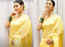 Kajol looks age defying in a yellow sari for Ganesh Chaturthi celebrations