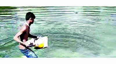 Throwing of idols in pond sparks row