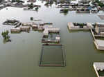 Homes are surrounded by floodwaters in Jaffarabad, a district of Pakistan's sout...