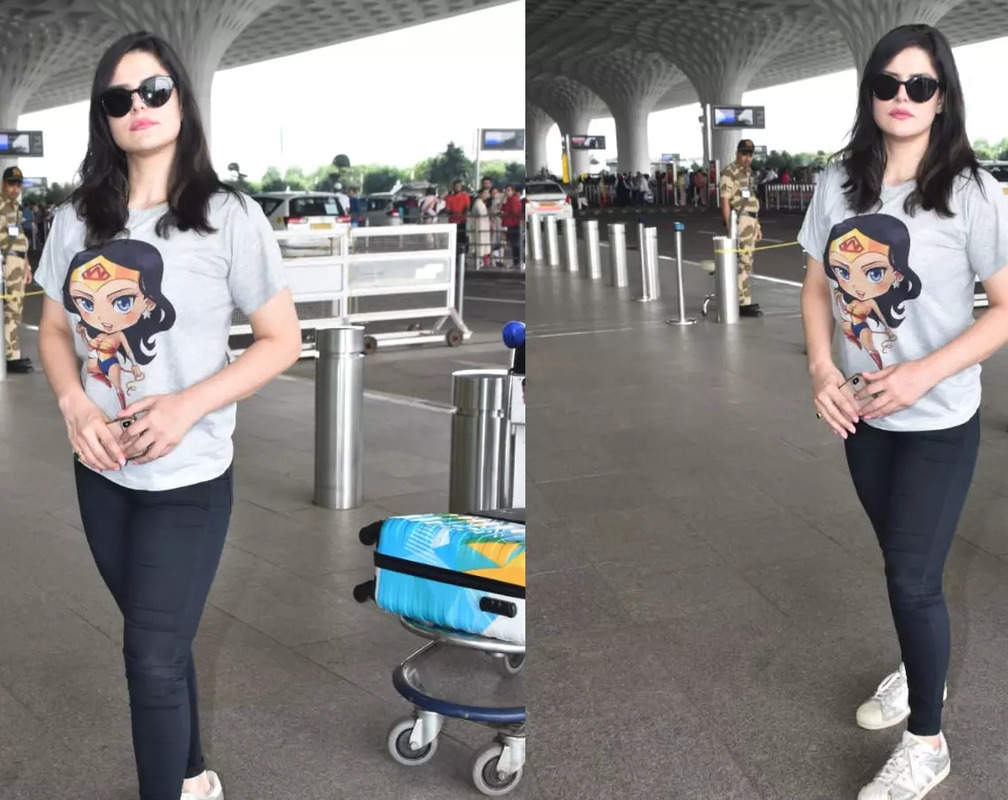 
Zareen Khan makes rare yet stylish appearance, dons casual printed T-shirt and black jeans, black sunglasses completes her airport look
