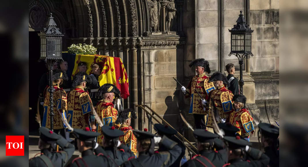 Queen’s coffin arrives in London as people queue up to bid farewell – Times of India