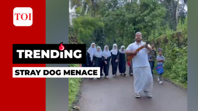 Kerala: Armed man escorts school children to protect them from stray dogs in Kasaragod