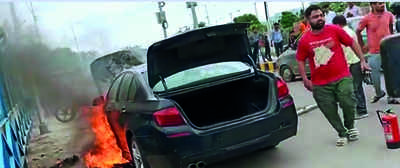 BMW car catches fire, driver escapes unhurt