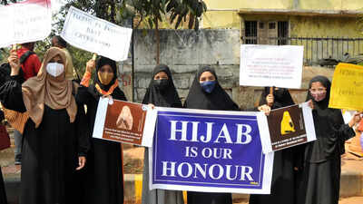 Karnataka Hijab Row: Karnataka order on uniform 'religion neutral', says  government | India News - Times of India