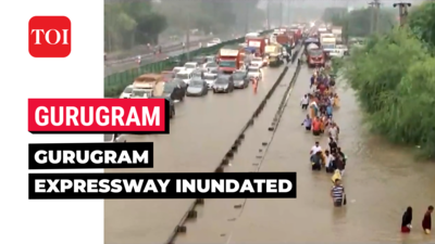 Heavy rains flood Delhi-Gurugram expressway causing traffic snarls, commuters walk in knee-deep water