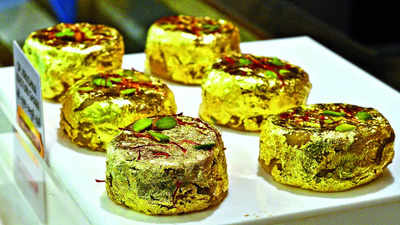 Surtis savour gold-leaf adorned traditional delicacies