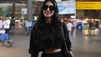 Mouni Roy robs hearts in a stunning black crop top and matching pants, completes her looks with a stylish bag and sunglasses