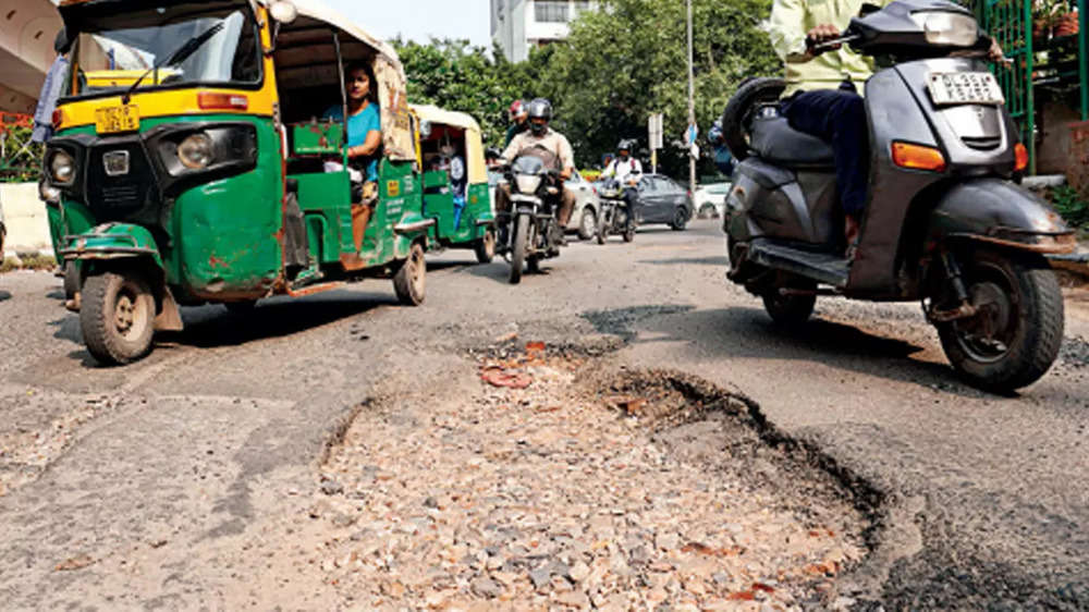 ​In pics: Pothole menace disrupts life in Delhi