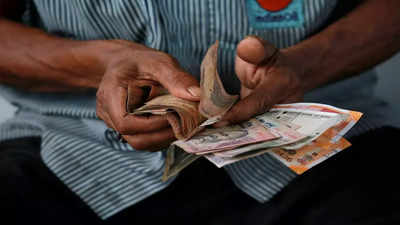Rupee posts another record low, but fares better than peers