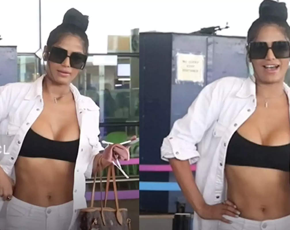 
Trolled! Poonam Pandey gets clicked at the airport wearing a sports bra; netizens say 'She is copying Urfi Javed'
