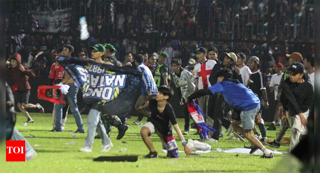Chaos before stampede delivered disaster to Indonesia football fans