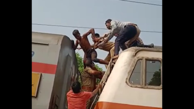 Uttar Pradesh: Mentally unstable youth climbs over train engine at Naini Junction