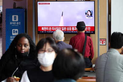North Korea fires missile over Japan, stopping trains and sparking warning message