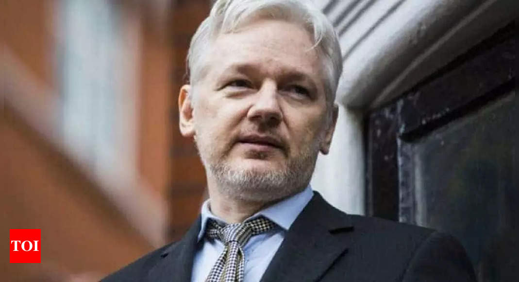 Julian Assange ill with Covid in prison: Wife – Times of India