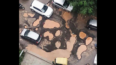 Noida: In Gaur City 2, pothole-ridden road gets worse after showers