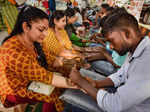 Prayagraj: Women get henna applied on their hands on the eve of 'Karwa Chauth' i...