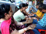 Amritsar: Women get henna applied on their hands on the eve of 'Karwa Chauth' in Amritsar, Wednesday, Oct. 12, 2022. (Photo:Pawan sharma/IANS)