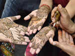 Nagpur: Married women getting henna done on their hands on the eve of Karwa Chauth festival, in Nagpur on Wednesday, Oct. 12, 2022. (Photo: Chandrakant Paddhane/IANS)