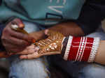 Jammu: A married woman gets henna applied on her hands on the eve of 'Karwa Chau...