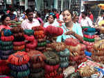 Patiala, Oct 11 (ANI): A woman looks to buy bangles at Adalat Bazar ahead of Kar...