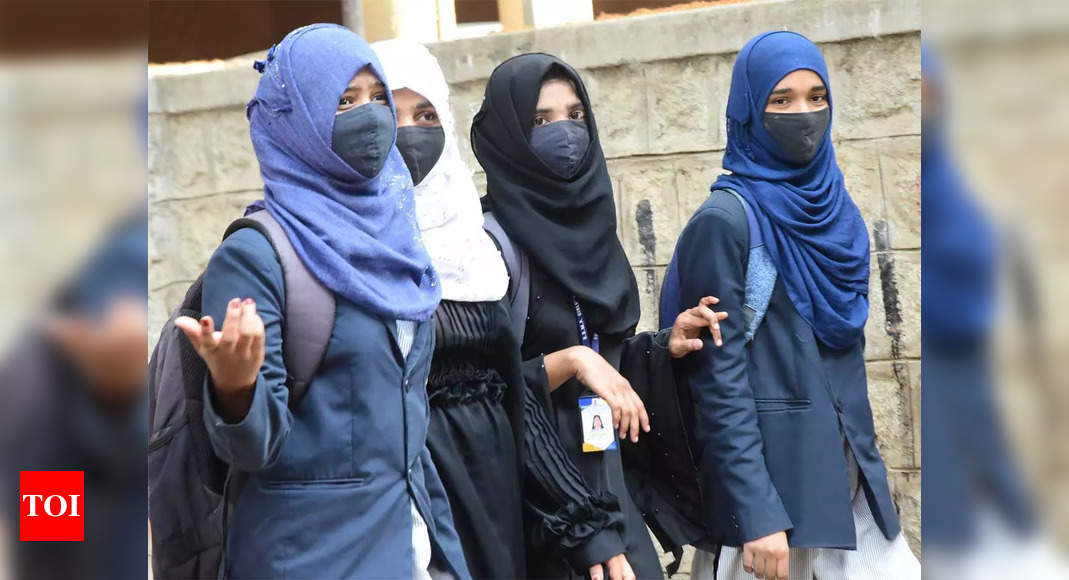 Asking girls to take off hijab invasion of privacy, attack on dignity: Justice Dhulia – Times of India