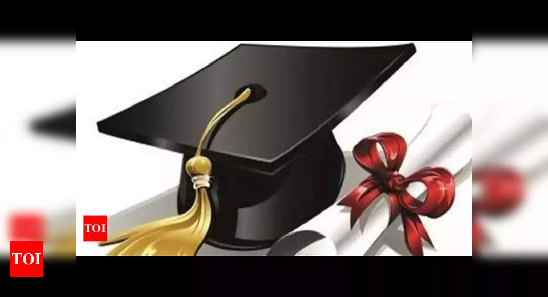 Graduate study abroad concept : Graduation cap on calendar paper