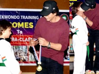 Shah Rukh Khan kisses AbRam, honours him with gold medal for winning Taekwondo tournament