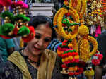 New Delhi: A woman buys decorative items from a shop at Sadar bazar ahead of Diwali festival, in New Delhi on Friday, Oct. 21, 2022. (Photo: Wasim Sarvar/IANS)