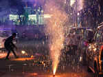 New Delhi: People burst firecrackers to celebrate Diwali festival, flouting the ...