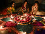 Nadia: Women light earthen lamps as part of the Diwali festival celebrations, in...