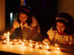 Sonitpur, Oct 24 (ANI): Girls lighting earthen lamps on the occasion of Diwali f...