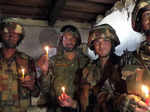 Poonch, Oct 23 (ANI): Indian Army personnel light candles as part of Diwali cele...