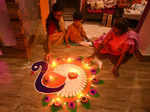 Nagaon:Women decorate a rangoli with earthen lamps on the occasion of Diwali festival in Nagaon District of Assan on Monday October 24,2022.(Photo: Anuwar hazarika/IANS)