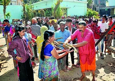 Organisations distribute puja items among needy