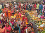 New Delhi: Devotees perform rituals during Chhath Puja festivities, at a tempora...