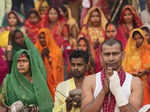 New Delhi: Devotees perform rituals during Chhath Puja festivities, at a tempora...