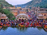 Jaipur: Devotees perform rituals during Chhath Puja festivities, at Galtaji temp...