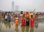 Noida: Devotees perform rituals of 'Chhath Puja', at Kalindi Kunj in Noida. (PTI...