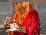 Noida: Devotees perform rituals of 'Chhath Puja', at Kalindi Kunj in Noida. (PTI...