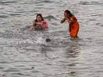 Mumbai: Devotees perform rituals of Chhath Puja, at Dadar Beach in Mumbai. (PTI ...