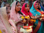 Bengaluru: Devotees perform rituals during 'Chhath Puja' festivities, at a makes...